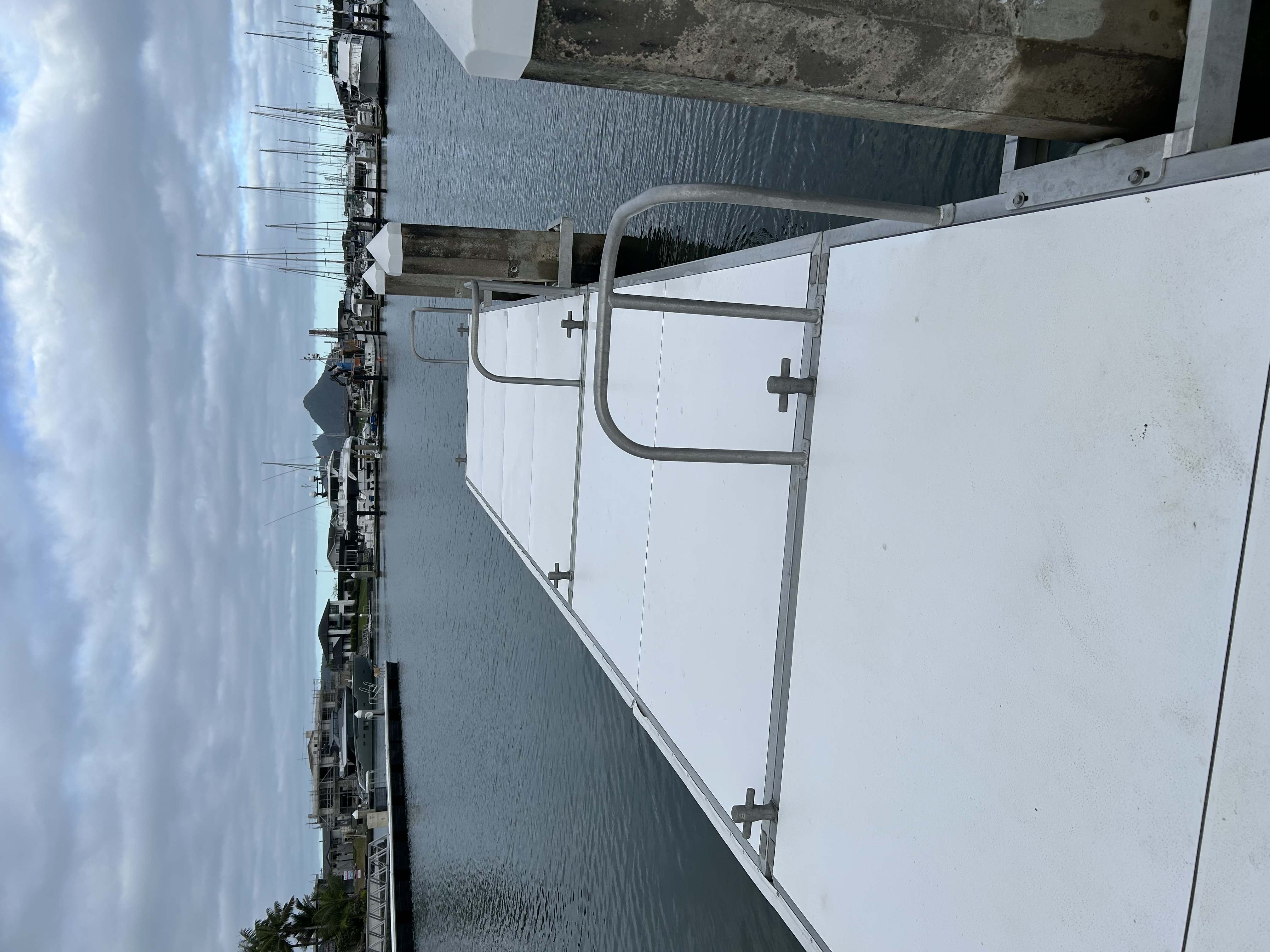 Freshly washed white marina pontoon walkway