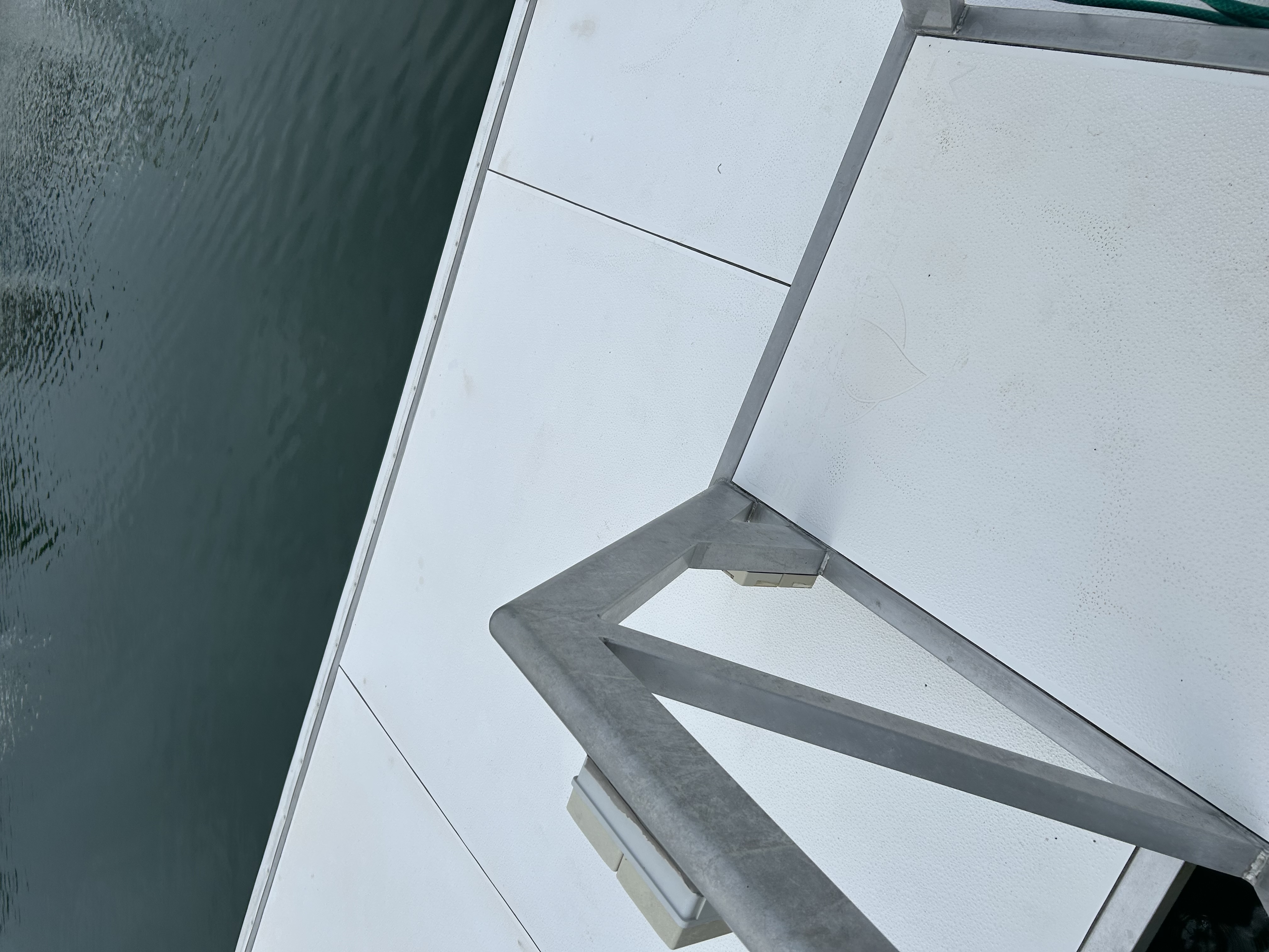 Spotless white floating dock and ladder